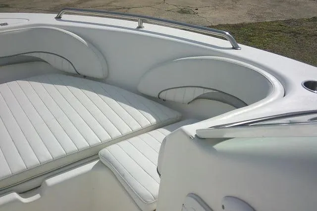 Slide: The Image of 2011 Tidewater 196 DC Explorer boat interior with white cushioned seating. - 11