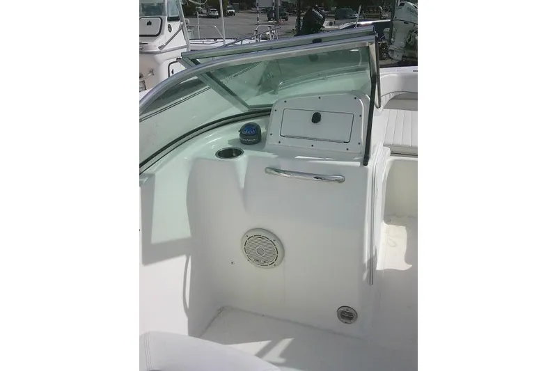 Slide: The Image of 2011 Tidewater 196 DC Explorer boat interior with dashboard and seating area. - 13