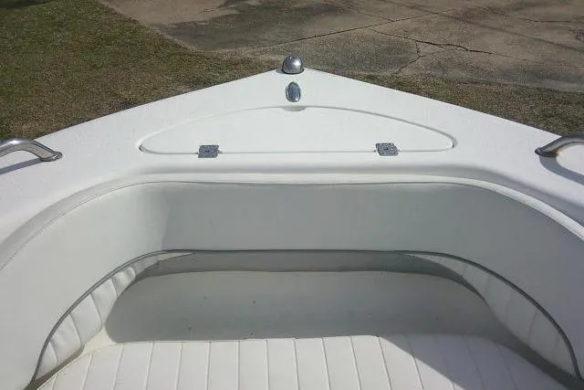 Slide: The Image of Bow seating area of 2011 Tidewater 196 DC Explorer boat, featuring white upholstery. - 16