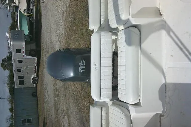 Slide: The Image of 2011 Tidewater 196 DC Explorer boat with outboard motor and white seating. - 25