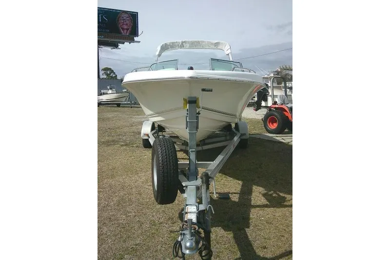 Slide: The Image of 2011 Tidewater 196 DC Explorer boat on trailer, parked outdoors. - 3