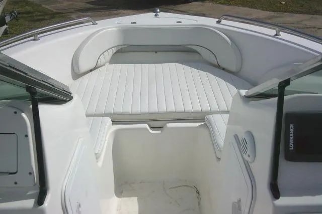 Slide: The Image of 2011 Tidewater 196 DC Explorer boat interior with white cushioned seating. - 9