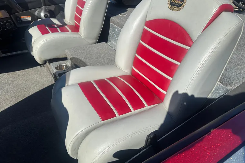 Slide: The Image of 2009 Triton 21X3 Pro DC boat seats with red and white upholstery. - 17
