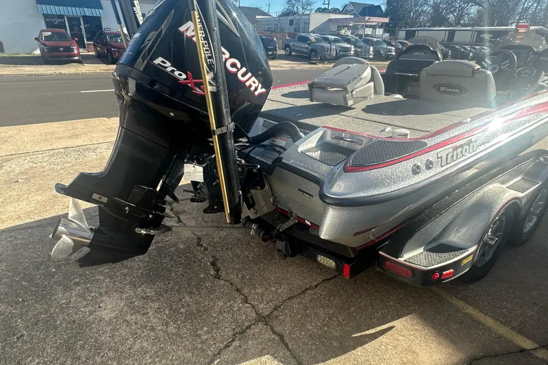 Slide: The Image of 2009 Triton 21X3 Pro DC boat with Mercury Pro XS engine, parked outdoors. - 19
