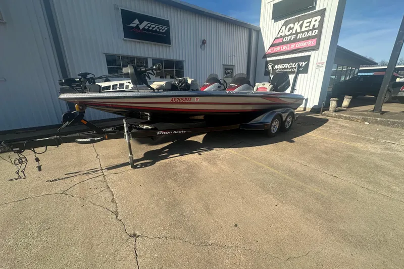 Slide: The Image of 2009 Triton 21X3 Pro DC boat on trailer outside dealership. - 4