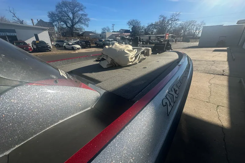 Slide: The Image of 2009 Triton 21X3 Pro DC boat parked outdoors on a sunny day. - 8
