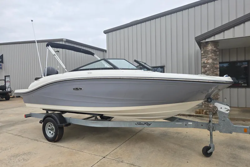 Slide: The Image of 2019 Sea Ray SPX 190 Outboard boat on trailer, parked outside a building. - 1