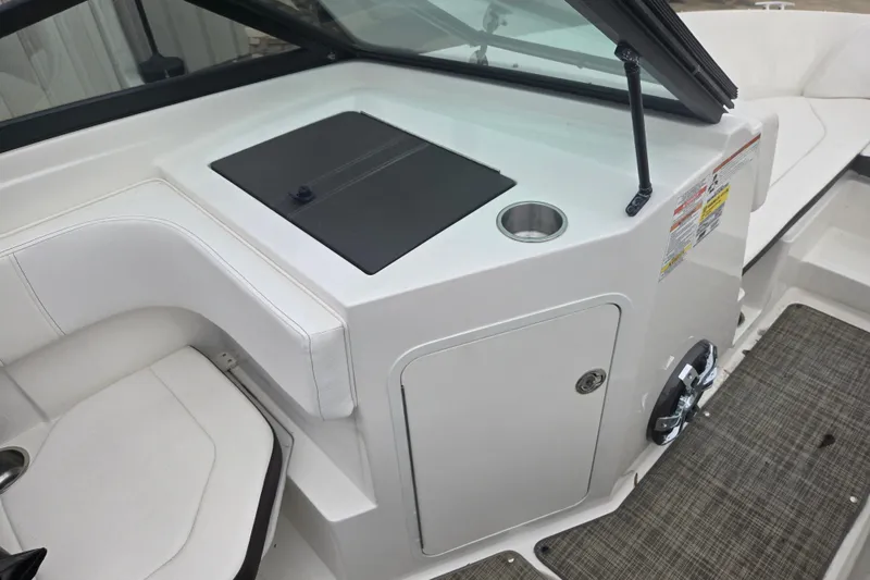 Slide: The Image of 2019 Sea Ray SPX 190 Outboard interior with seating and storage compartment. - 11