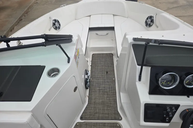 Slide: The Image of 2019 Sea Ray SPX 190 Outboard boat interior with dashboard and seating area. - 15