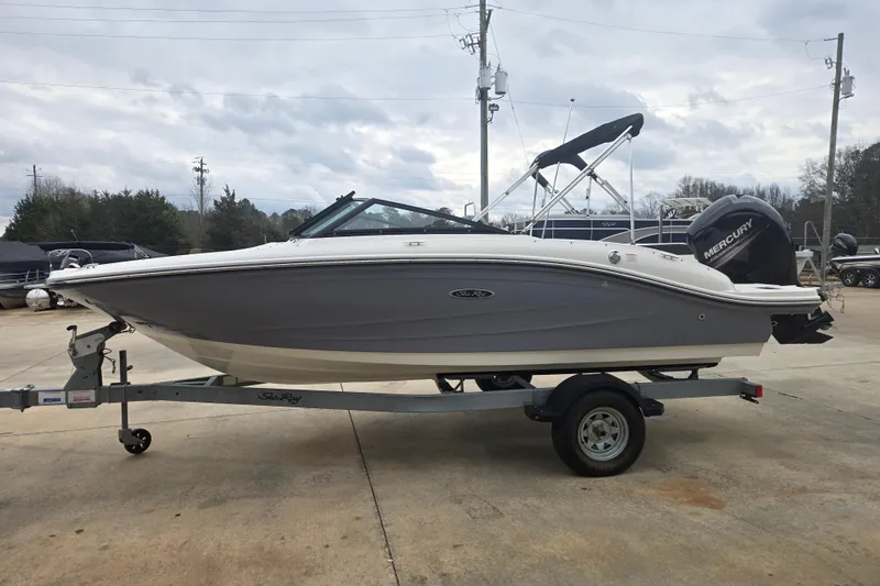 Slide: The Image of 2019 Sea Ray SPX 190 Outboard boat on trailer, parked outdoors. - 3