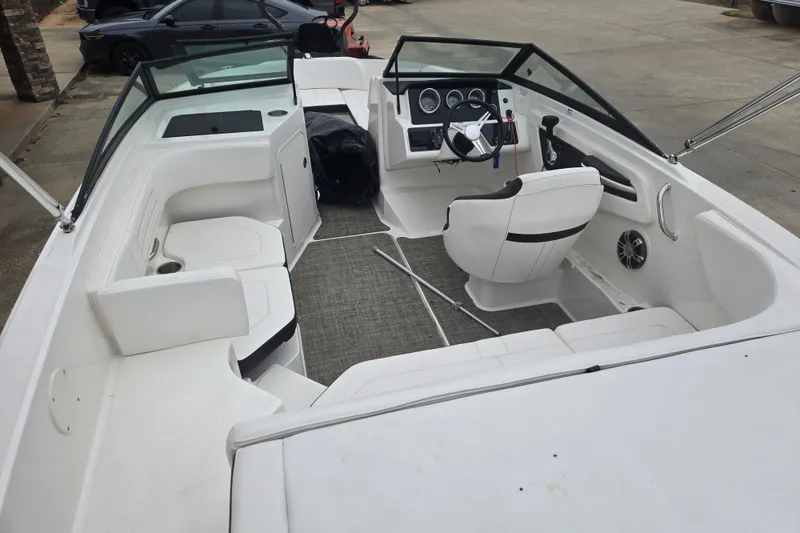 Slide: The Image of 2019 Sea Ray SPX 190 Outboard boat interior with seating and steering console. - 6