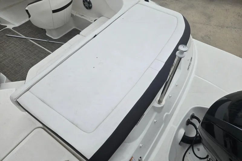 Slide: The Image of 2019 Sea Ray SPX 190 Outboard boat interior with seating and motor detail. - 9