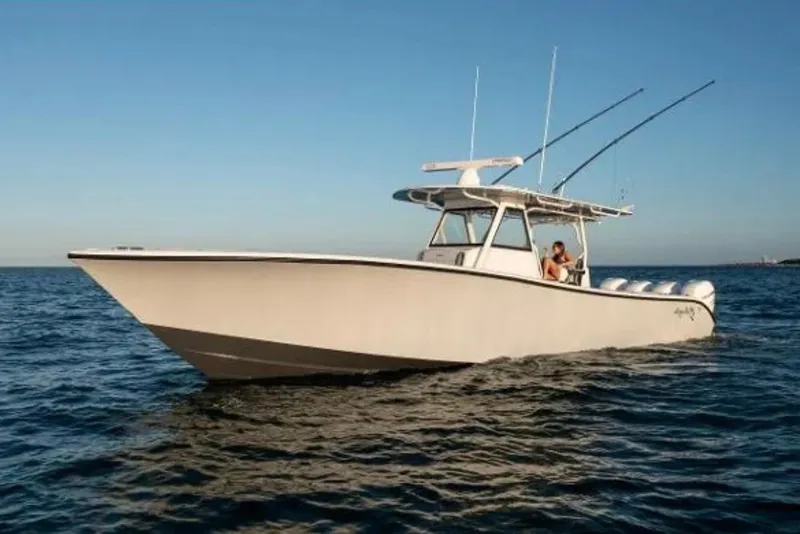 The Image of 2019 Yellowfin 39 Offshore boat cruising on open water under clear blue sky. - 1
