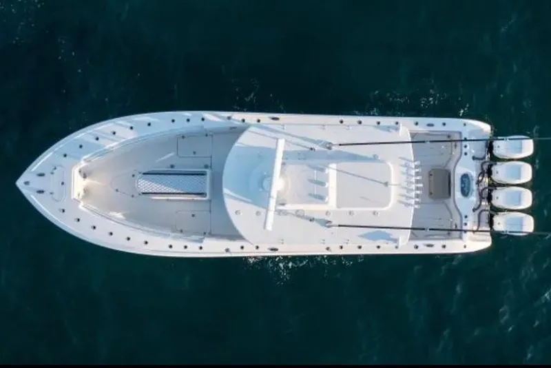 Slide: The Image of 2019 Yellowfin 39 Offshore boat cruising at sunset on open water. - 11