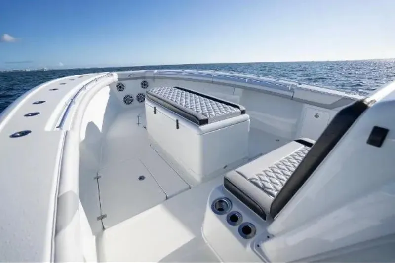 Slide: The Image of 2019 Yellowfin 39 Offshore boat cruising on open water at sunset. - 14