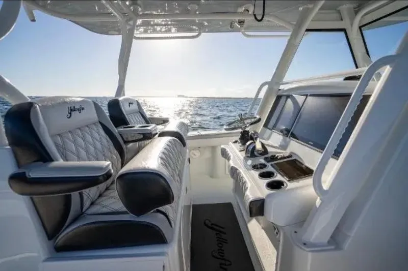 Slide: The Image of 2019 Yellowfin 39 Offshore boat cruising on open water at high speed. - 18