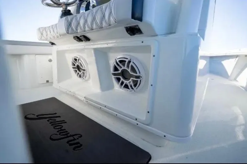 Slide: The Image of 2019 Yellowfin 39 Offshore boat cruising on open water at sunset. - 19