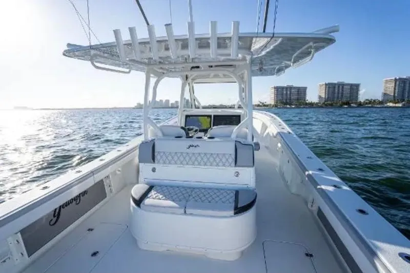 Slide: The Image of 2019 Yellowfin 39 Offshore boat interior with seating, on calm ocean waters. - 20