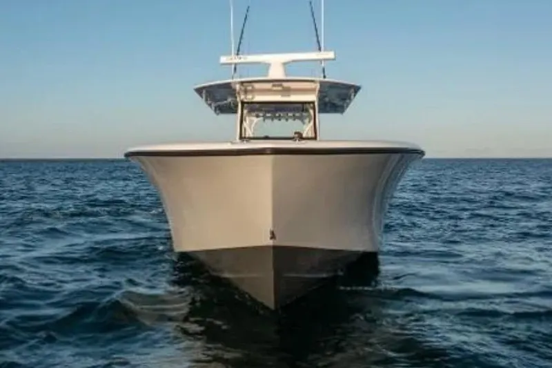 Slide: The Image of 2019 Yellowfin 39 Offshore boat cruising on open water under clear blue sky. - 3
