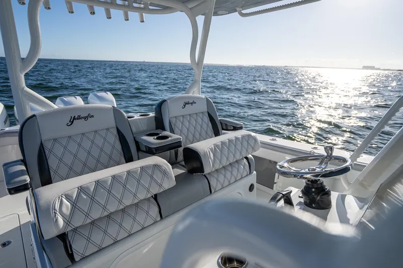 Slide: The Image of 2019 Yellowfin 39 Offshore boat interior with luxurious seating and ocean view. - 32