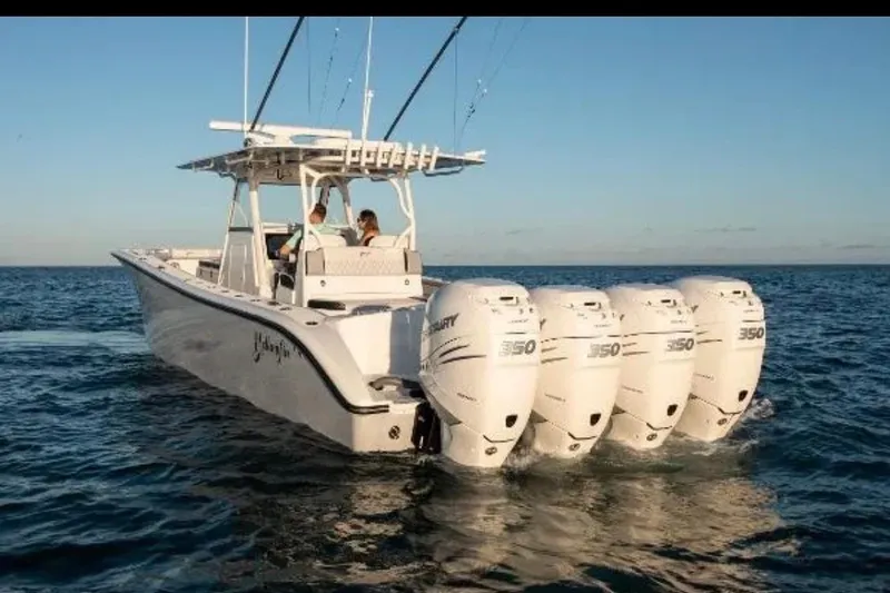 Slide: The Image of 2019 Yellowfin 39 Offshore boat cruising on open water at sunset. - 5