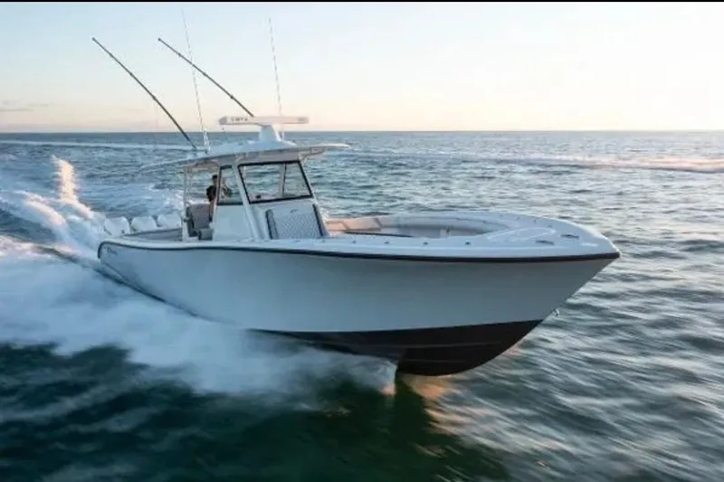Slide: The Image of 2019 Yellowfin 39 Offshore boat on open sea, front view, clear sky. - 9