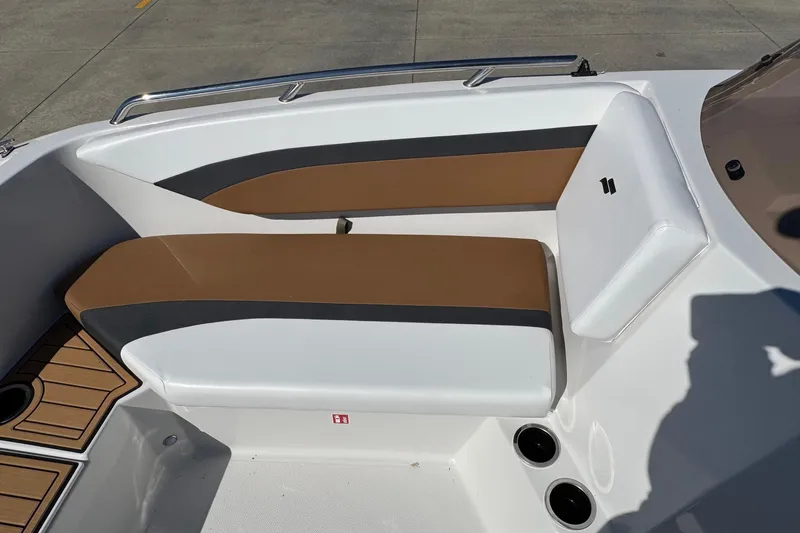 Slide: The Image of 2026 Starcraft SVX 171 OB boat interior with brown and white seating. - 16