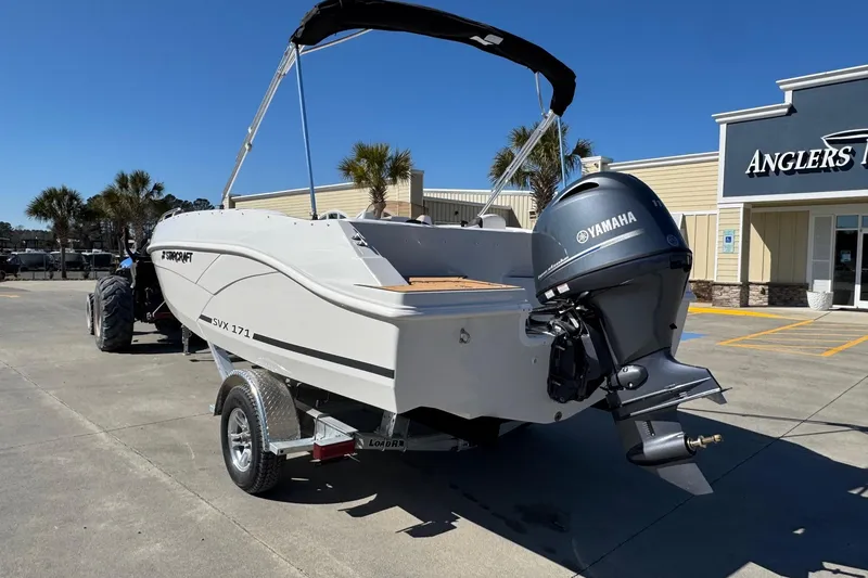 Slide: The Image of 2026 Starcraft SVX 171 OB boat with Yamaha outboard motor in a parking lot. - 3