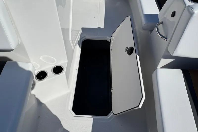 Slide: The Image of 2026 Starcraft SVX 171 OB boat interior storage compartment with open hatch. - 6