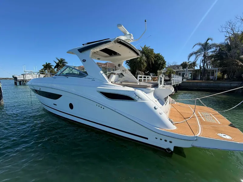 Slide: The Image of 2016 Sea Ray Sundancer 350 yacht docked on a sunny day. - 11