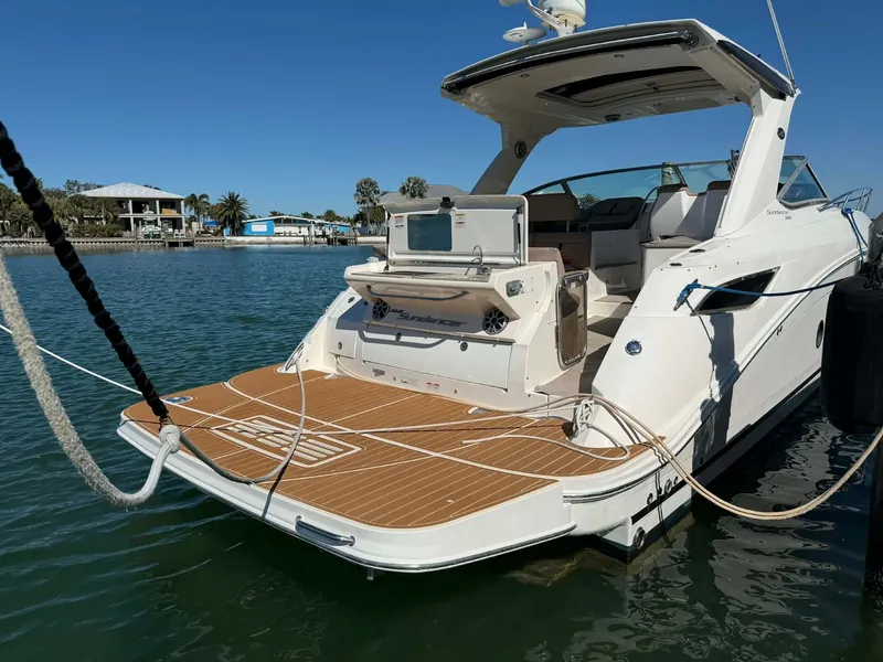 Slide: The Image of 2016 Sea Ray Sundancer 350 yacht docked on water. - 12