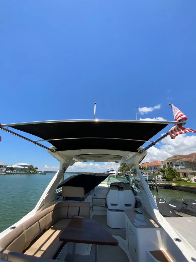 Slide: The Image of 2016 Sea Ray Sundancer 350 yacht with sunshade on the water. - 30