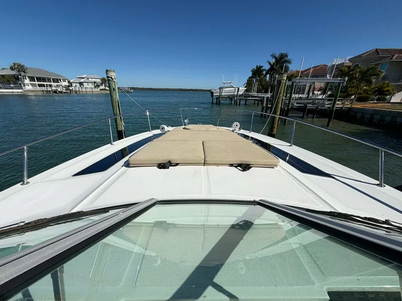 Slide: The Image of 2016 Sea Ray Sundancer 350 on calm water near docks. - 34