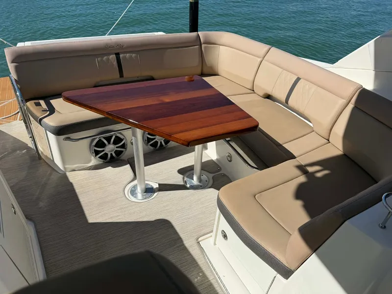 Slide: The Image of Interior of 2016 Sea Ray Sundancer 350 yacht with beige seating area. - 39