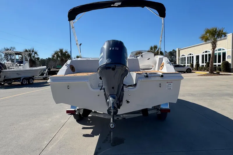 Slide: The Image of Rear view of a 2026 Starcraft SVX 171 OB boat with outboard motor. - 2