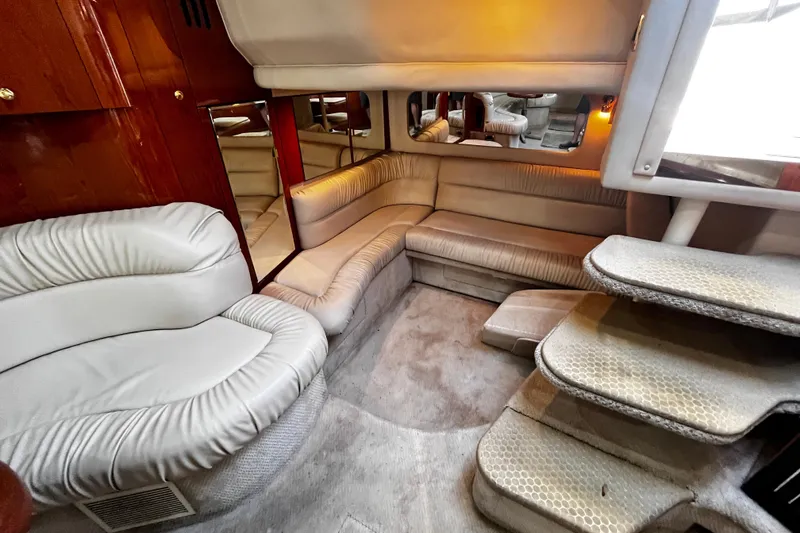 Slide: The Image of Luxurious interior of 1999 Sea Ray 380 Sundancer yacht with plush seating and elegant design. - 17