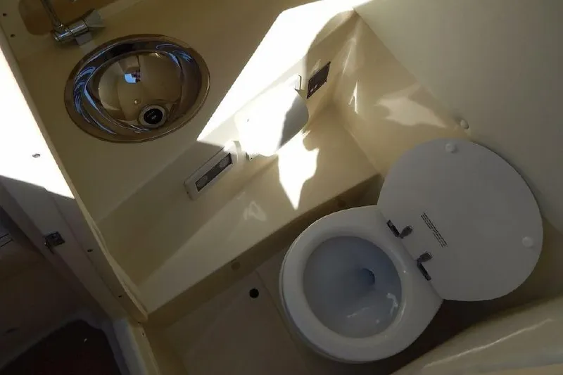 Slide: The Image of 2012 Chris-Craft Launch 28 boat bathroom with sink and toilet. - 10