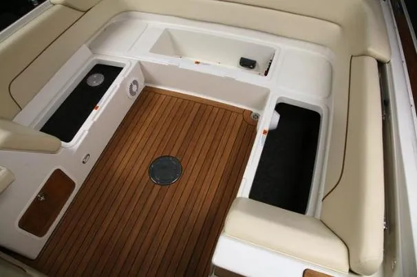 Slide: The Image of 2012 Chris-Craft Launch 28 boat with beige leather seating and open deck design. - 3