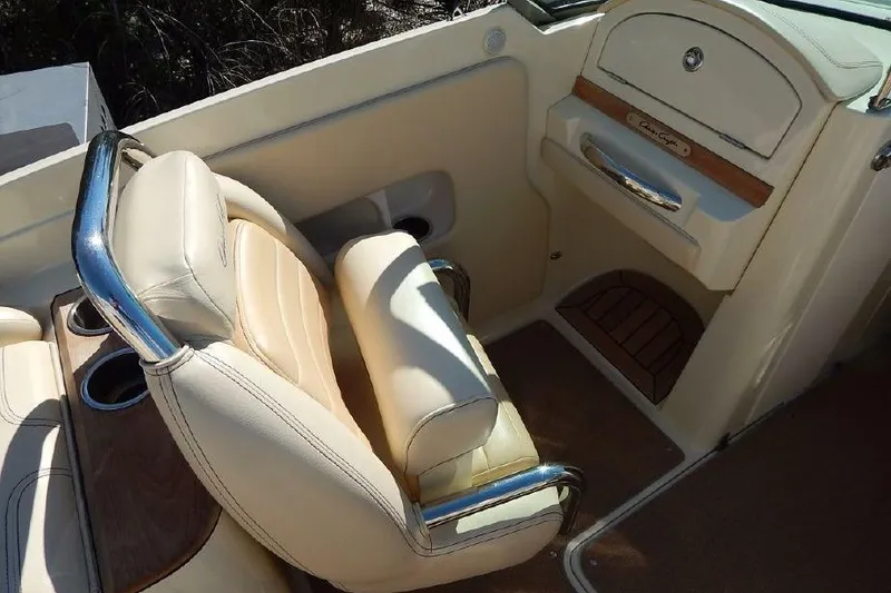 Slide: The Image of 2012 Chris-Craft Launch 28 interior with beige leather seating and wood accents. - 6