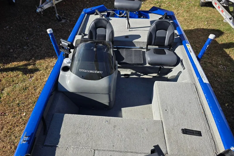 Slide: The Image of 2006 Tracker Pro Team 175 boat interior with seating and steering console. - 12