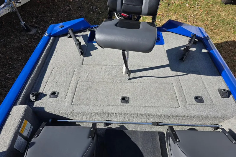 Slide: The Image of 2006 Tracker Pro Team 175 boat interior with gray carpet and seating. - 15