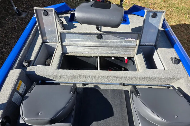Slide: The Image of 2006 Tracker Pro Team 175 boat interior with storage compartments and seating. - 16