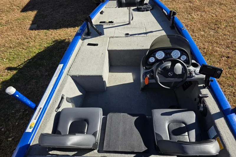Slide: The Image of 2006 Tracker Pro Team 175 boat interior with steering console and seating. - 7