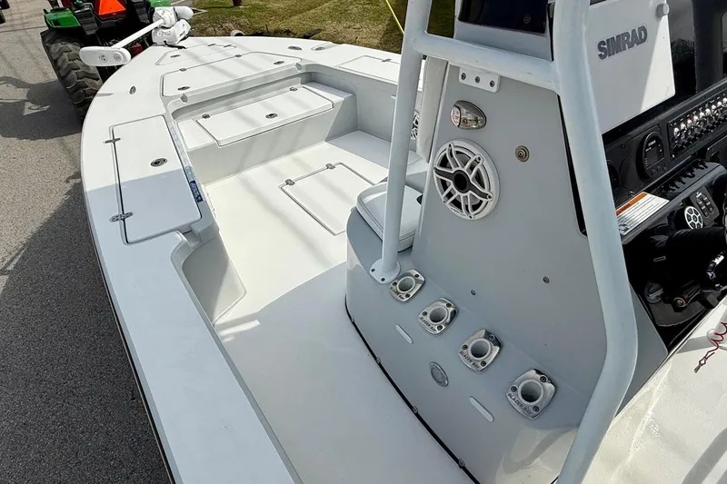 Slide: The Image of 2020 Blazer Bay 2420 GTS boat interior with storage compartments and control panel. - 12