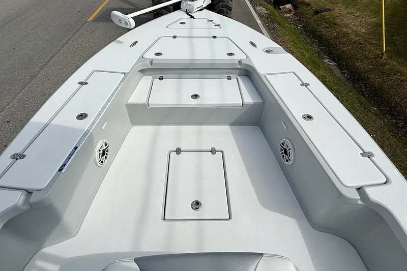 Slide: The Image of 2020 Blazer Bay 2420 GTS boat deck with storage compartments and speakers. - 13