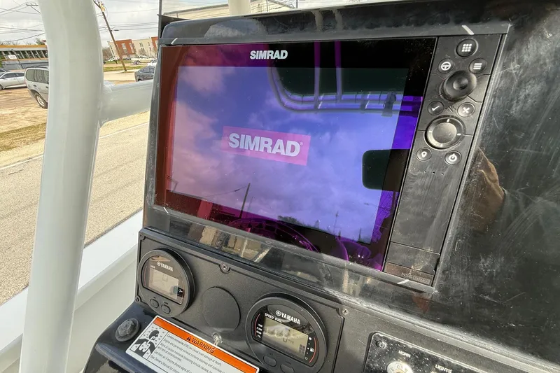 Slide: The Image of Simrad display on 2020 Blazer Bay 2420 GTS boat dashboard with Yamaha gauges. - 16