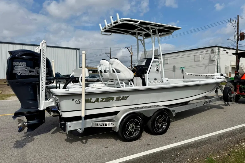 Slide: The Image of 2020 Blazer Bay 2420 GTS boat on trailer, featuring Yamaha outboard motor. - 4