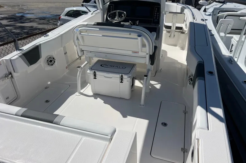 The Image of 2026 Robalo R250 Center Console boat interior with seating and steering console. - 0