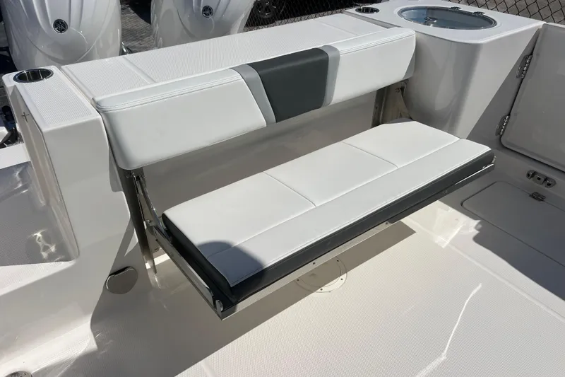 Slide: The Image of 2026 Robalo R250 Center Console boat with foldable white seating. - 13