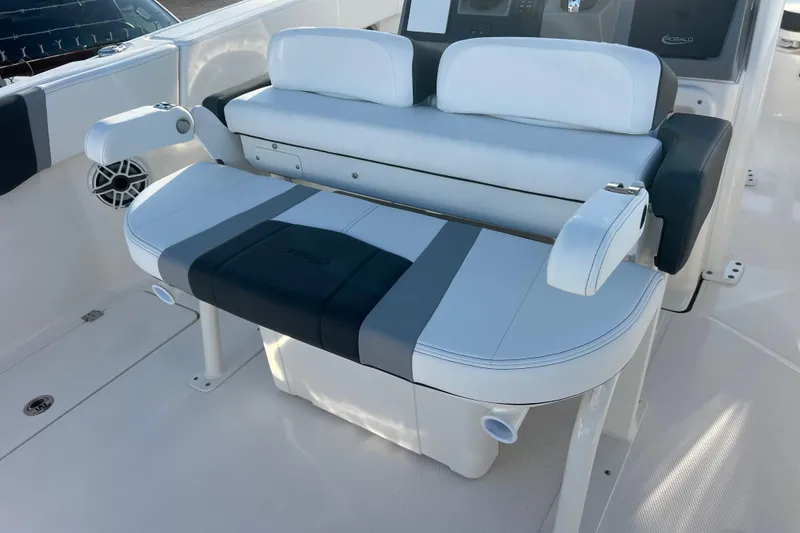 Slide: The Image of 2026 Robalo R250 Center Console boat seating with armrests and storage. - 2